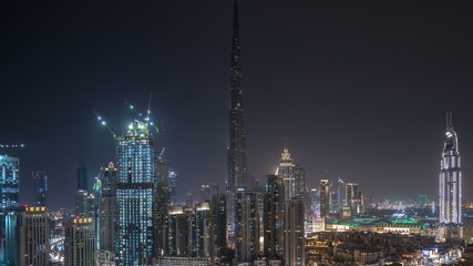 Fototapeta na wymiar Dubai downtown cityscape with Burj Khalifa, LightUp light show aerial timelapse