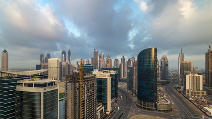 Fototapeta premium Dubai business bay towers early morning aerial timelapse.