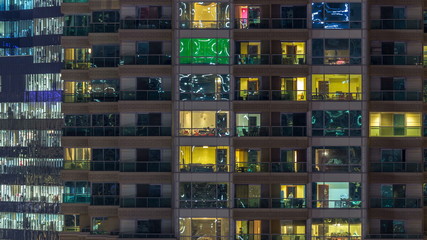 Scenic glowing windows of skyscrapers at evening timelapse