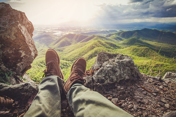 Man hiker of tourist on mountain is cloud and sky beautiful landscape
