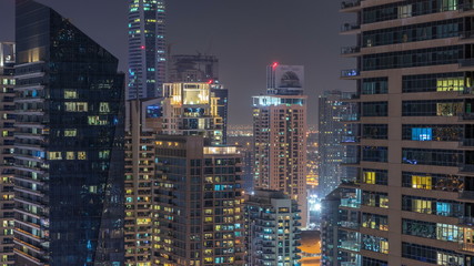 Fototapeta na wymiar Dubai Marina and JLT at night timelapse, Glittering lights and tallest skyscrapers