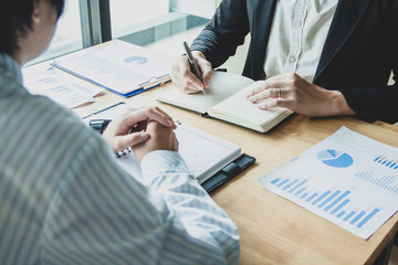 Close-up. Asian business of hand holding pen reviewing and signing,Home buying contract,Selective focus