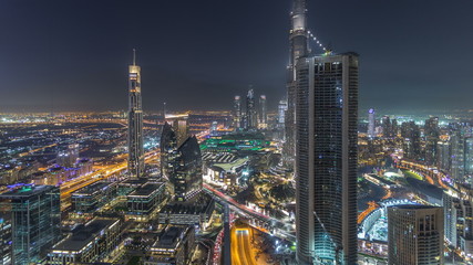 Dubai Downtown night timelapse modern towers panoramic view from the top in Dubai, United Arab Emirates.