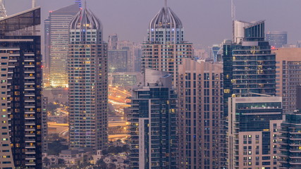 Obraz premium Beautiful aerial top view day to night transition timelapse of Dubai Marina