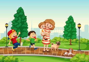 Obraz na płótnie Canvas Mother and children at the park