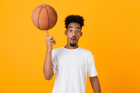 Excited young african man in t-shirt