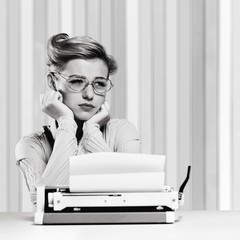 Attractive young woman speaking on vintage phone