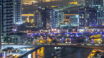 Fototapeta premium Water canal on Dubai Marina skyline at night timelapse.