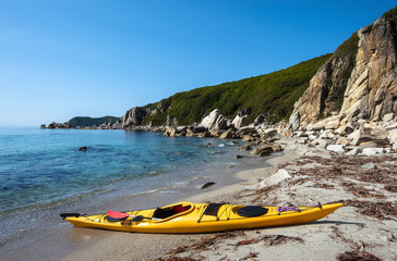 Sea kayak on the sea coast.