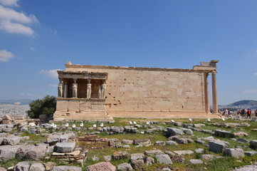 Fototapeta premium Side Facade of the Erechtheion known as The Caryatids At The Acropolis Of Athens. History, Architecture, Travel, Cruises. July 9, 2018. Acropolis Of Athens, Greece.