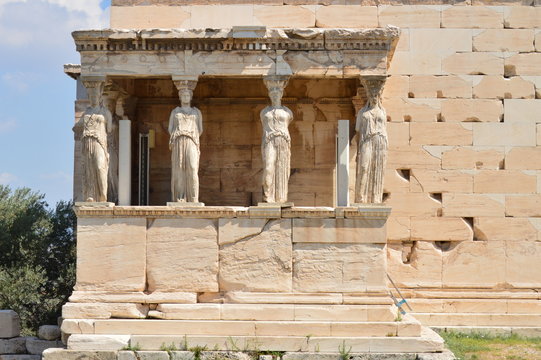 Set Of Beautiful Sphinxes On The Facade Of The Erechtheion Known As The Caryatids In The Acroplis Of Athens. History, Architecture, Travel, Cruises. July 9, 2018. Acropolis Of Athens, Greece.