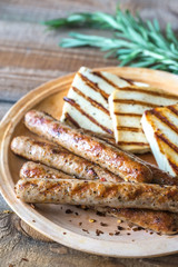 Grilled sausages and cheese with rosemary
