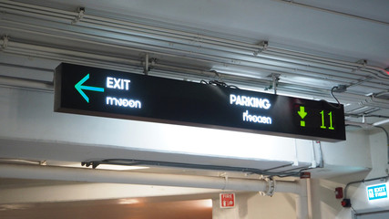 Digital parking signs with showed available space by green color.