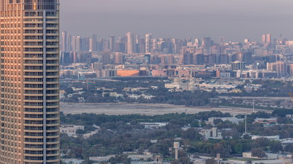 Skyline view of Deira and Sharjah districts in Dubai timelapse at sunset, UAE.