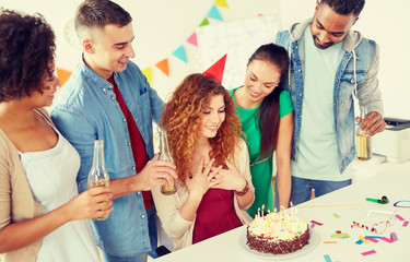 corporate and people concept - happy team of coworkers with non-alcoholic drinks and cake celebrating birthday at office party