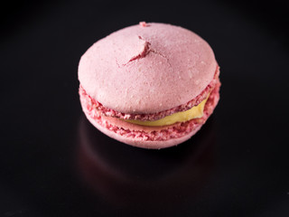 Macaroon on dark background, colorful french cookies macaroons
