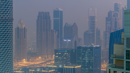 Foggy morning in downtown of Dubai night to day timelapse.