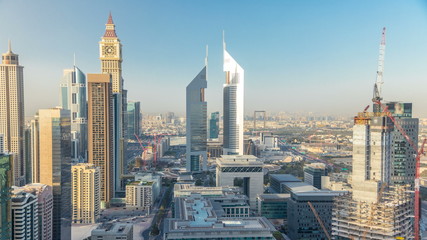 Fototapeta na wymiar Skyline view of the buildings of Sheikh Zayed Road and DIFC timelapse in Dubai, UAE.