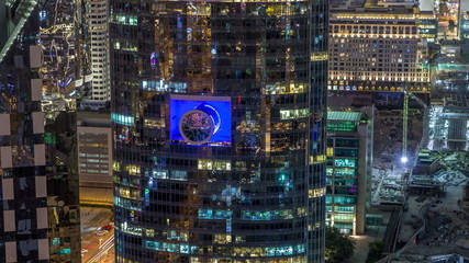 Skyline view of the buildings of Sheikh Zayed Road and DIFC night timelapse in Dubai, UAE.