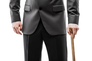 Businessman in black suit holding walking cane stick