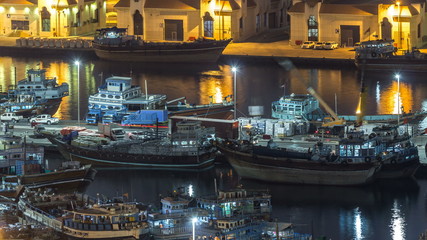 Loading a ship in Port Said night timelapse in Dubai, UAE.