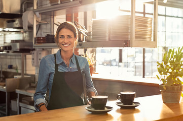 Waitress at cafe counter