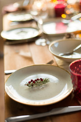 christmas, holidays and eating concept - table served for festive dinner at home