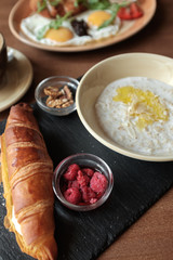 Healthy breakfast with oatmeal and raspberries