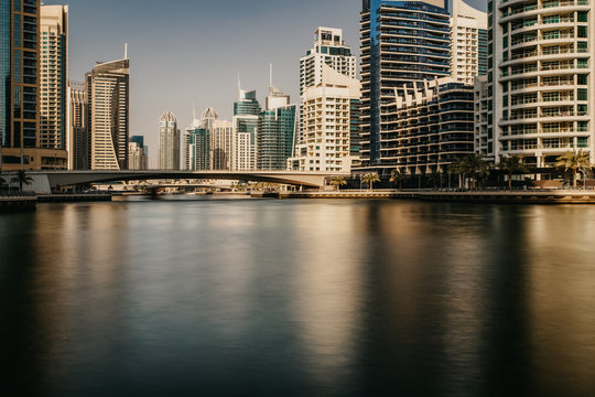 Beautiful view to Dubai Marina Promenade, UAE. Long exposure time lapse effect