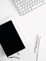 Office workspace. White office desk. Laptop, phone, notebook, pencil. Flat lay, top view, copy space 