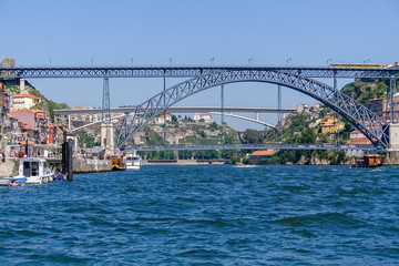 19th century Dom Luis I bridge over Douro River with Porto city (L) and Gaia (R). Infante D. Henrique Bridge in background. Porto, Oporto, Portugal
