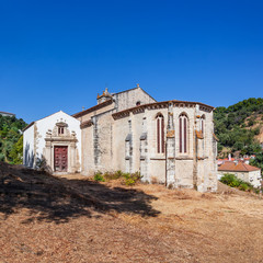 Fototapeta na wymiar Santarem, Portugal. Gothic apse of the Igreja de Santa Cruz Church with a view of the baroque chapel and portal on the left. 13th century Gothic Architecture