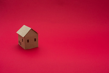 Obraz na płótnie Canvas Paper Home, red background with copy space, for advertising, close up,