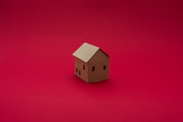 Paper Home, red background with copy space, for advertising, close up