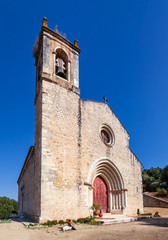 Fototapeta na wymiar Santarem, Portugal. Facade with gothic portal and bell tower or belfry of the Igreja de Santa Cruz Church. 13th century Gothic Architecture