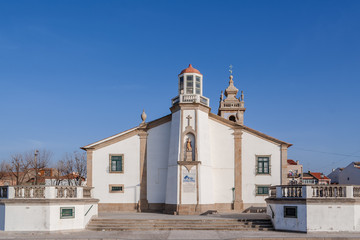 Nossa Senhora da Lapa church with a lighthouse imbedded in Povoa de Varzim, Portugal. Where local fishermen and families seek help in times of danger