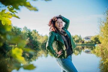 Plus size nice American or Asian apperance woman at park, enjoy the life, walks outdoor. Life of...