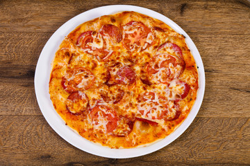 Pepperoni pizza with sausages