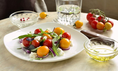 Green salad with cherry tomatoes and cottage cheese