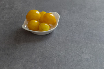 A bowl full of colorful garden tomatoes