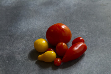 A row of red and yellow tomatoes