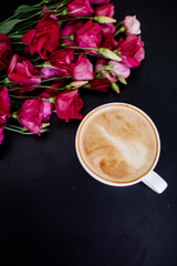 Cappuccino, eclairs and flowers.
