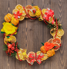 Christmas wreath, new year, on a dark background of natural wood, copy space