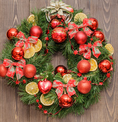 Christmas wreath, new year, on a dark background of natural wood