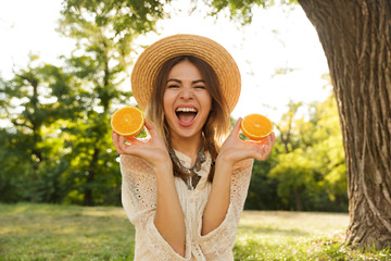 Close up of happy young girl in summer hat