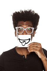 Happy young african man with smile, drawn on sheet of paper on white background
