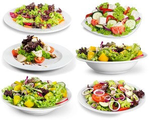 Different kinds of salads on background