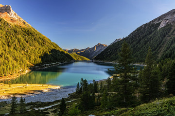 Fototapeta na wymiar Lappago Lake (Neves Lake) - A Glacier Lake situated in The Alps Valley (Aurina Valley)