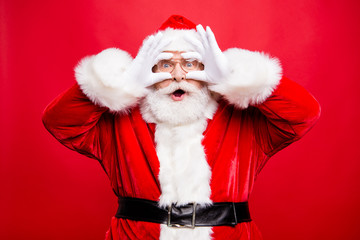 Wish come true! Astonishment stylish aged Santa in costume glove