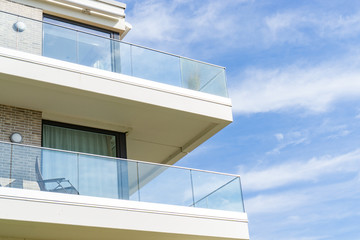 View of a house with balcony on a sunny day - 225494099